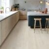 Modern kitchen with light oak vinyl flooring and wooden cabinetry