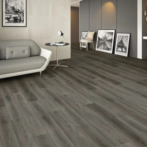 Nebraska wild oak plank flooring in modern living room with grey sofa and framed artwork