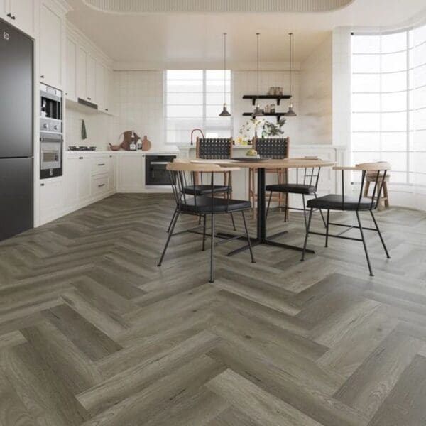 Alva french grey parquet flooring installed in a modern kitchen with dining area