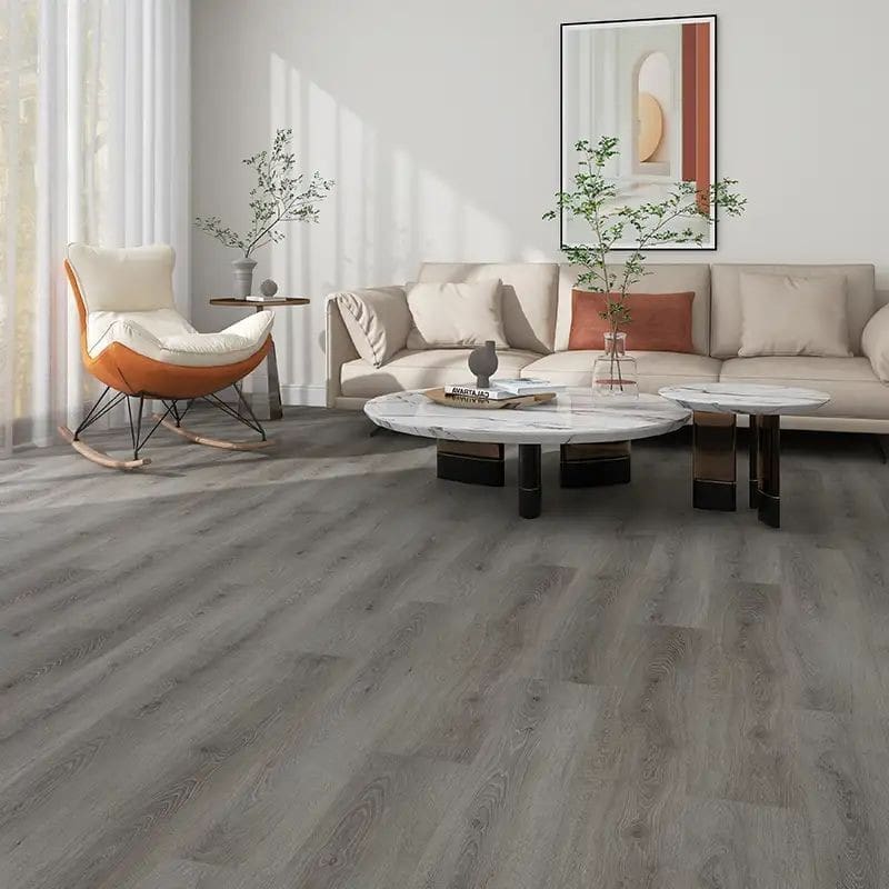 Alva hickory grey oak plank flooring in modern living room with cream sofa and orange accent chair