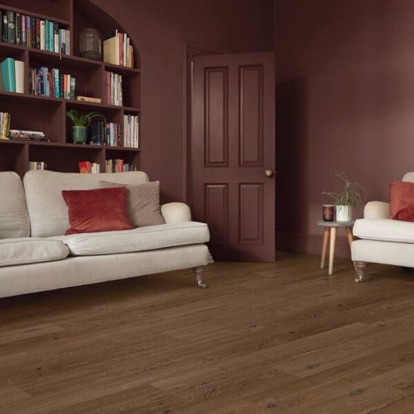 Roma oak pvp405 flooring in contemporary living space with bookshelves and seating