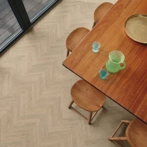Dining area with wooden table and chairs on dolce prime flooring