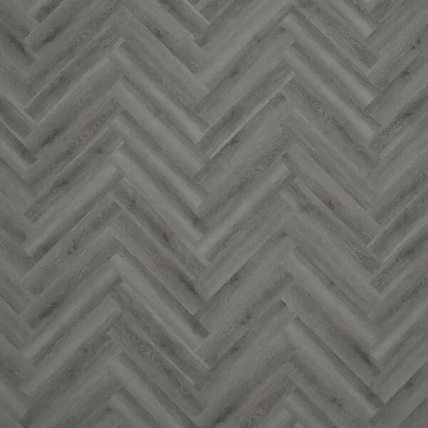 Close up of millennium oak parquet flooring showing herringbone pattern and wood grain detail