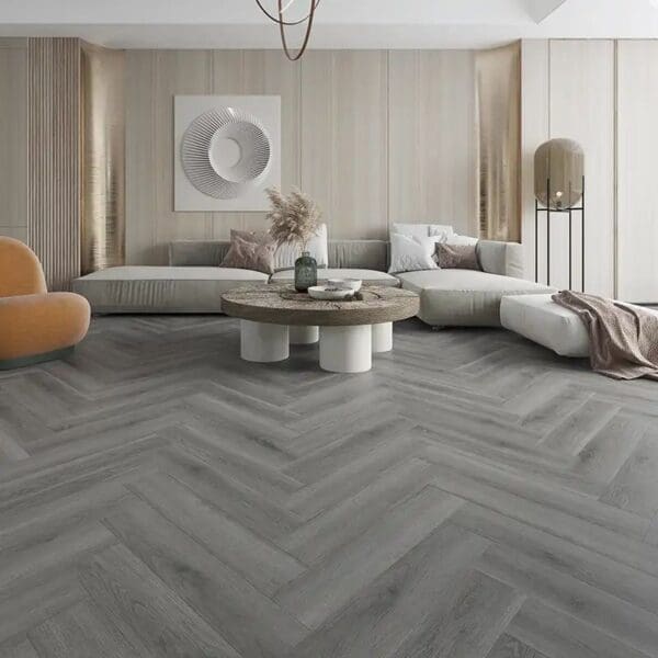 Millennium oak parquet flooring in modern living room with gray sofa and round coffee table