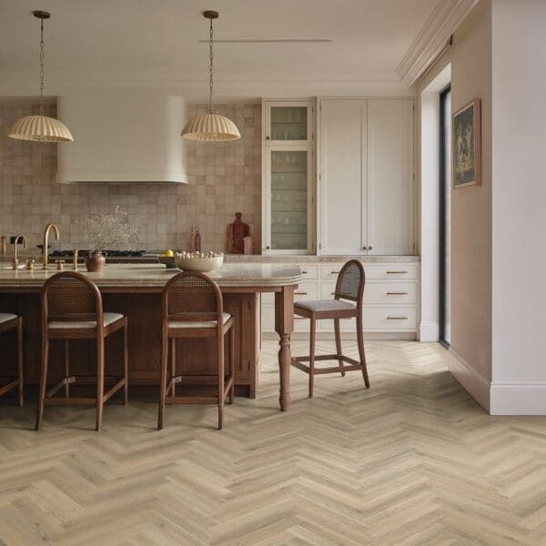 Sorrento oak herringbone flooring installed in modern kitchen with wooden island