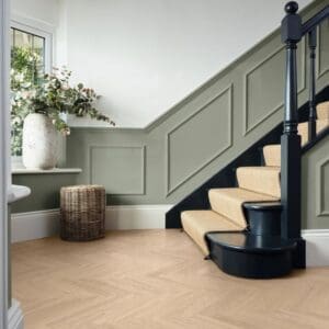 Florentine oak luxury vinyl flooring installed in modern hallway with stairs