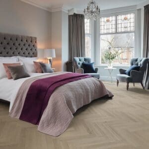 Elba oak herringbone flooring installed in elegant bedroom
