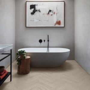 Verona prime herringbone flooring in modern bathroom with freestanding tub