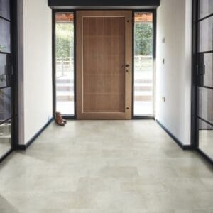 Karndean Palio Essenza Torino Cemento PVT702 installed in modern hallway with wooden door