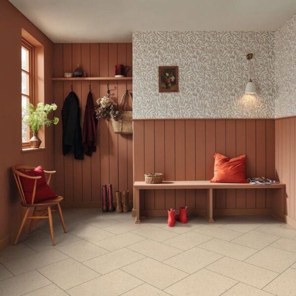 Ischia limestone pvt703 installed in entryway with terracotta walls and wooden bench