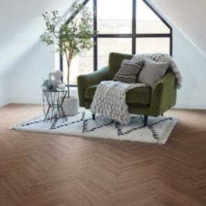 Roma oak herringbone flooring in modern living room with green chair