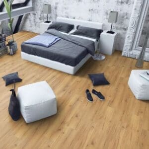 Natural oak laminate flooring in contemporary bedroom with white furniture and grey accents
