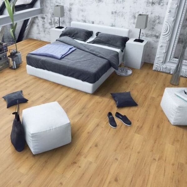 Natural oak laminate flooring in contemporary bedroom with white furniture and grey accents