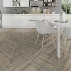 Minimalist white kitchen with volcanic oak herringbone flooring