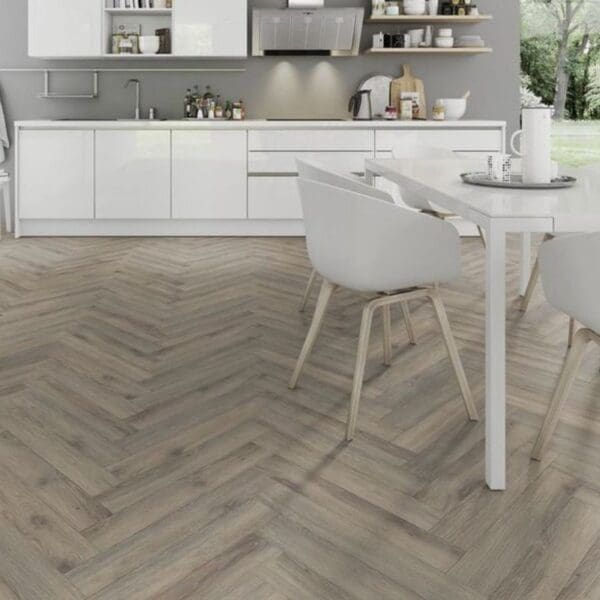 Minimalist white kitchen with volcanic oak herringbone flooring