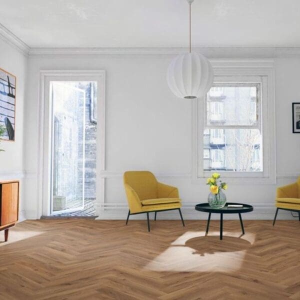 Bright living room with yellow chairs and lignum fusion premium robust fumed oak herringbone flooring