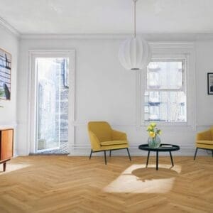 Bright living room with yellow accent chairs and oak herringbone flooring