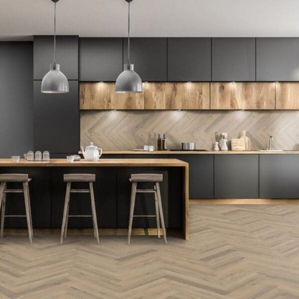 Modern kitchen with island and greige oak herringbone laminate flooring