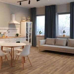 Open plan kitchen and living space with robust fumed oak laminate flooring