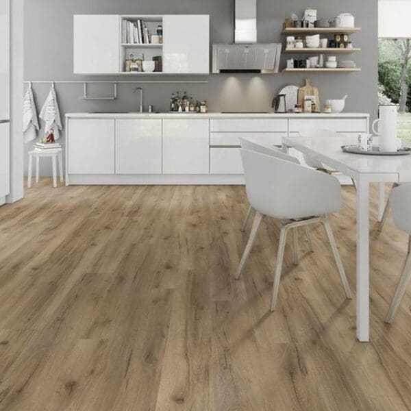 Albany oak laminate flooring in modern kitchen with white cabinets and dining area