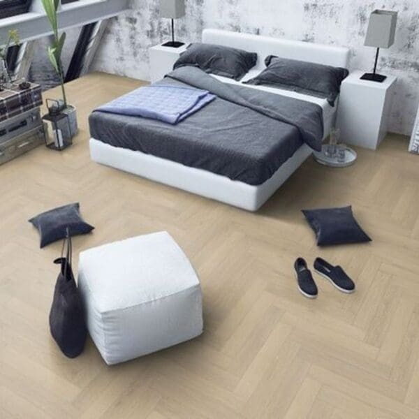 Contemporary bedroom with light oak herringbone flooring and minimalist decor