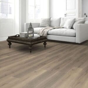Greige oak laminate flooring in all white kitchen with modern dining furniture
