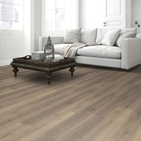 Greige oak laminate flooring in all white kitchen with modern dining furniture