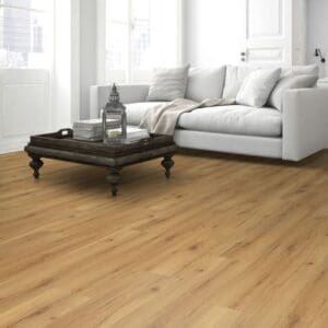 Natural oak laminate flooring in living room with blue sofa and ceramic fireplace