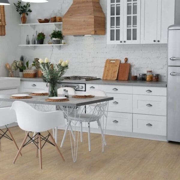 Desert oak laminate flooring in white kitchen with dining table and chairs