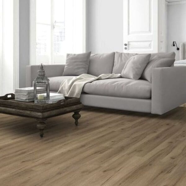 Albany oak laminate flooring in modern living room with grey sofa and coffee table
