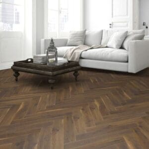 Cozy living room with fireplace and coffee oak herringbone laminate flooring
