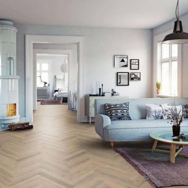 Living room with fireplace and greige oak herringbone laminate flooring