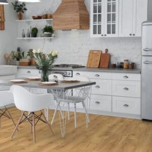 Natural oak laminate flooring in white kitchen with dining table and wooden accents