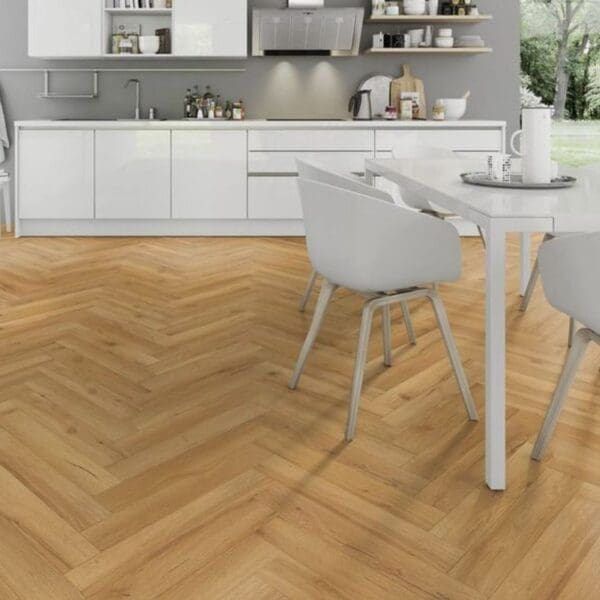 Modern white kitchen with dining area and oak herringbone flooring