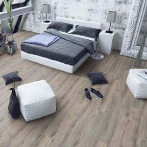 Contemporary bedroom with white furniture and volcanic oak laminate flooring