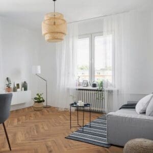 Modern living room with lignum fusion premium robust fumed oak herringbone flooring and minimalist furniture