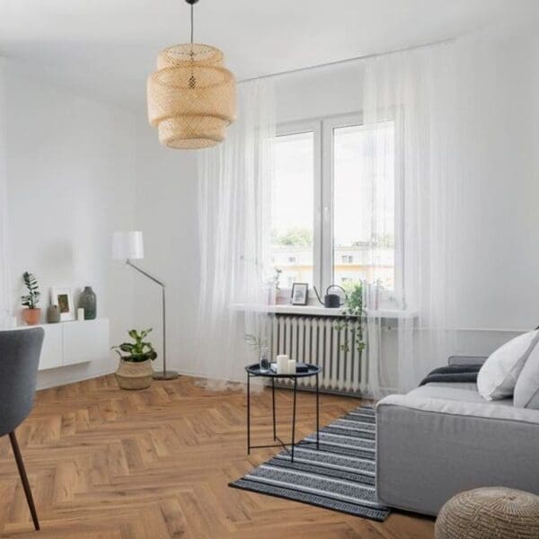 Modern living room with lignum fusion premium robust fumed oak herringbone flooring and minimalist furniture