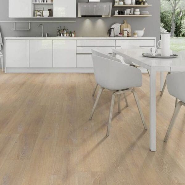 Desert oak laminate flooring in white kitchen dining area with modern chairs