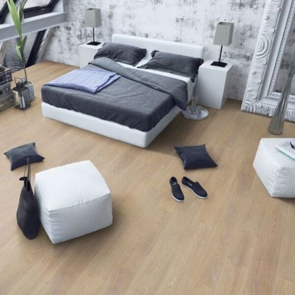 Desert oak laminate flooring in contemporary bedroom with white and grey decor
