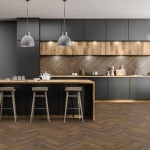 Modern kitchen with dark cabinets and coffee oak herringbone laminate flooring
