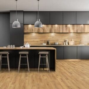 Natural oak laminate flooring in contemporary kitchen with black cabinets and wood accents