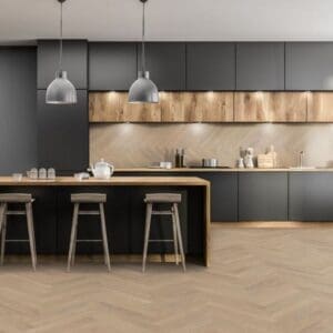 Modern kitchen with black cabinets and desert oak herringbone laminate flooring