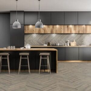 Contemporary kitchen with dark cabinets and volcanic oak herringbone flooring