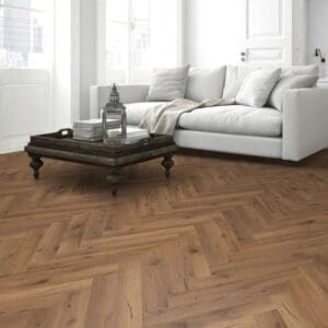 Cozy living room with fireplace and lignum fusion premium robust fumed oak herringbone flooring