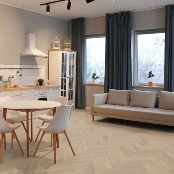 Open plan living space with desert oak herringbone laminate flooring and neutral decor