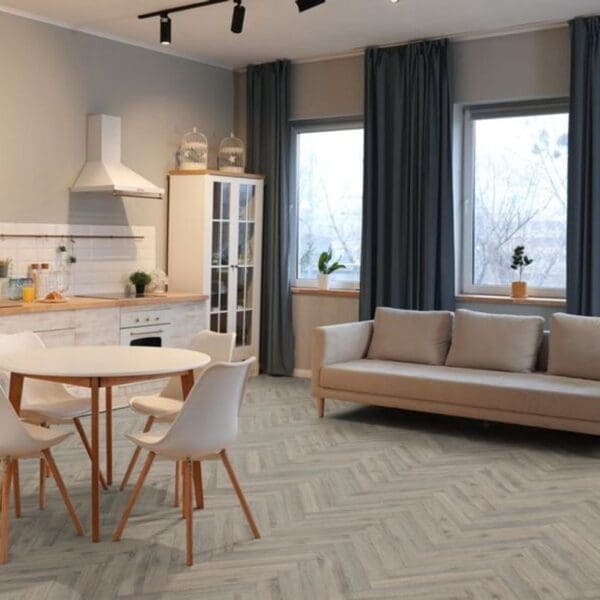 Open plan kitchen and living space with volcanic oak herringbone flooring
