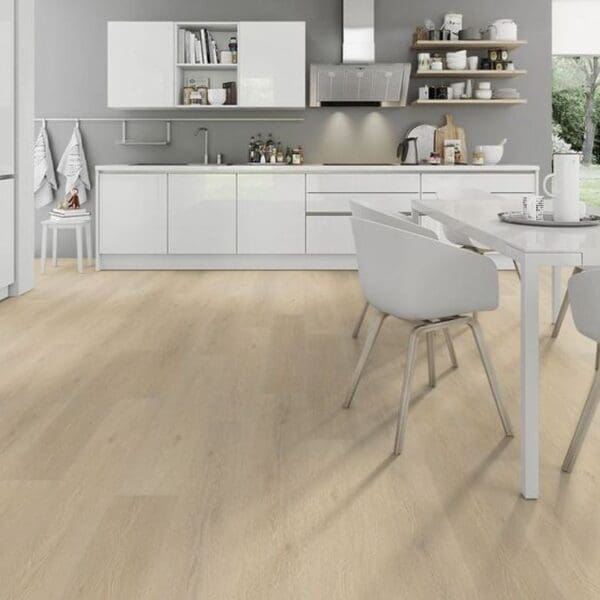 Light oak laminate flooring in contemporary white kitchen with dining area