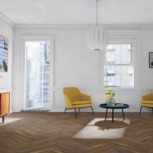 Bright living room with yellow accent chairs and coffee oak herringbone laminate flooring