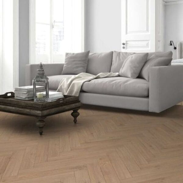 Lignum fusion premium oregon oak herringbone flooring installed in modern living room with grey sofa