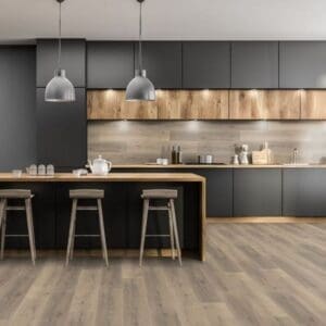 Greige oak laminate flooring in contemporary kitchen with black cabinets and wooden accents